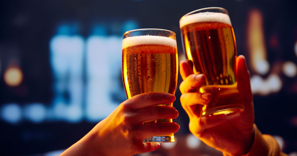 hands cheersing with beer