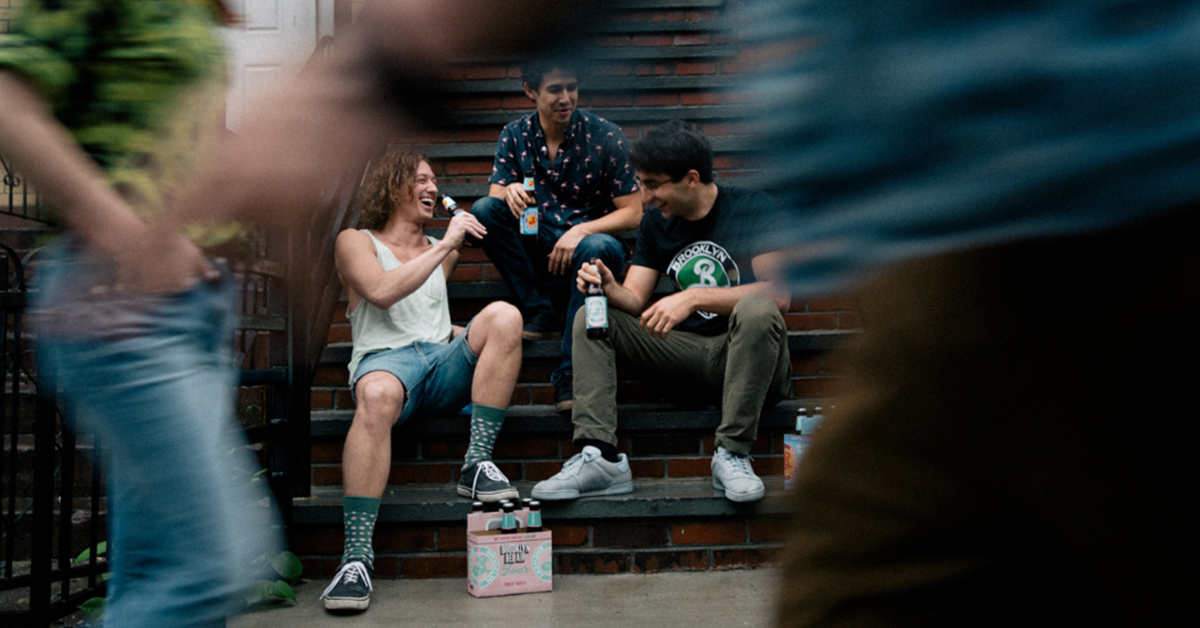 people sitting on porch drinking beer