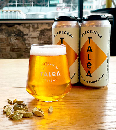 talea beer co cans of cardamom lager and poured beer with fresh cardamom pods